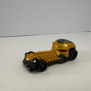 Hot Wheels Skull Crusher 2009 Mattel Gold Black Skeleton Diecast Car 1:64 Scale